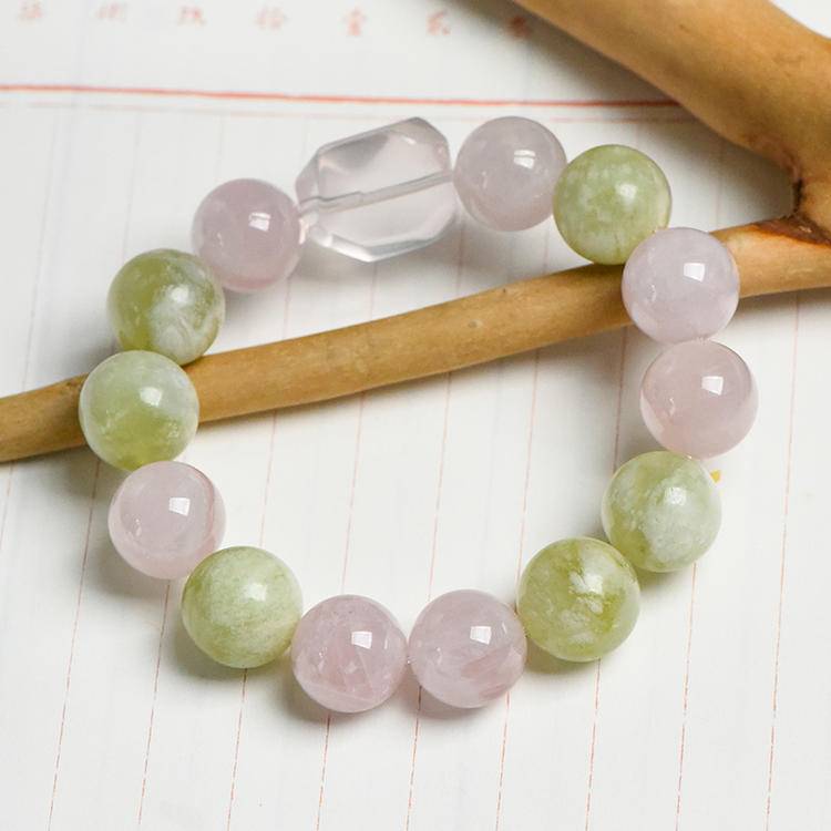 Rose quartz, Xiuyu jade, and clear quartz multi-gem bracelet promoting healing, balance, and positive energy.