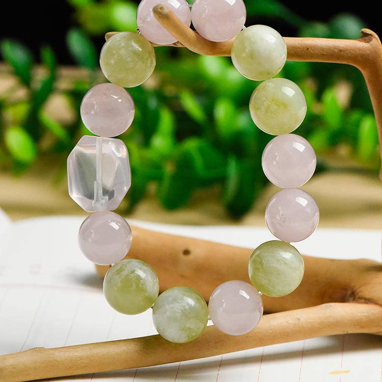 Multi-gem bracelet with rose quartz, Xiuyu jade, and clear quartz designed to enhance healing, balance, and positive energy.