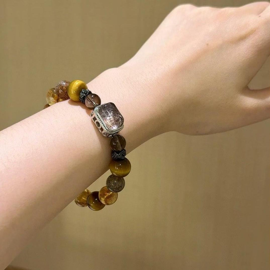 Healing bracelet featuring tiger eye and citrine for grounding, clarity, and emotional well-being.