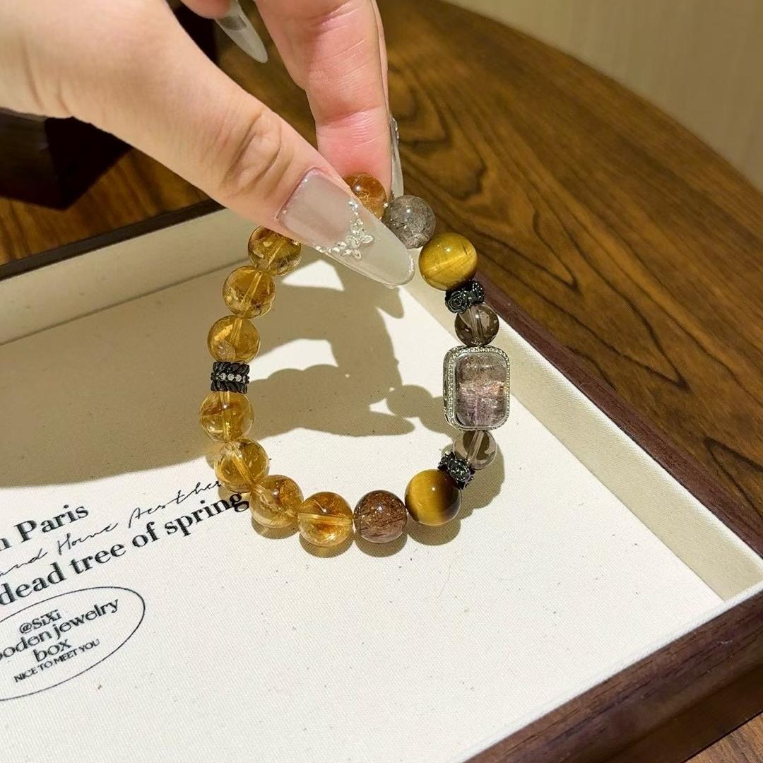 Multi-gem bracelet with tiger eye and citrine designed to enhance healing, focus, and positive energy.