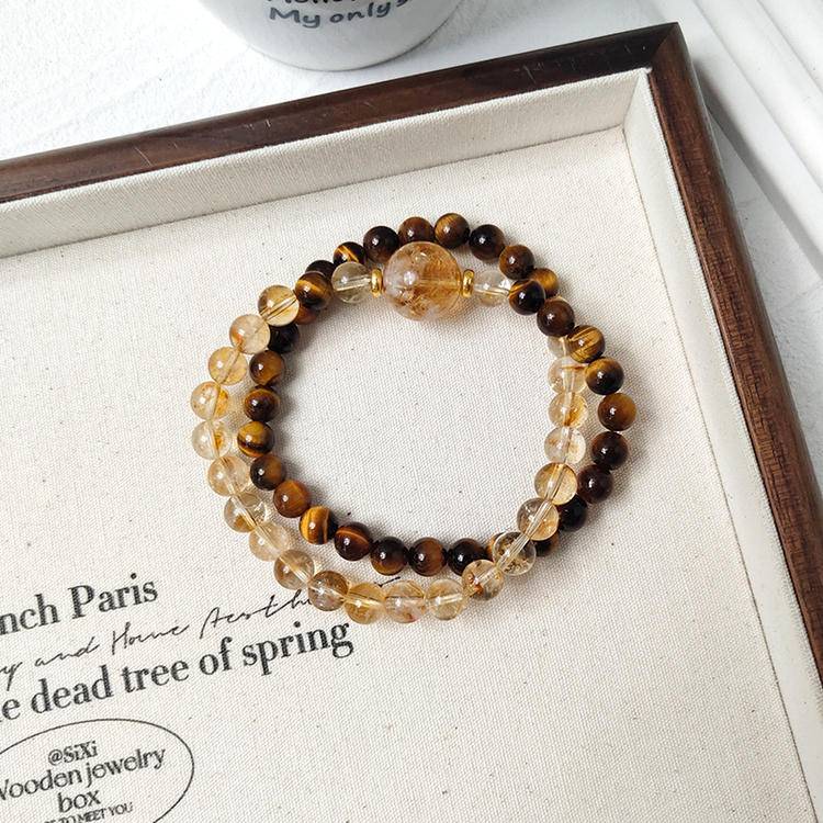 Healing multi-gem bracelet featuring tiger eye and citrine for protection, prosperity, and focus.