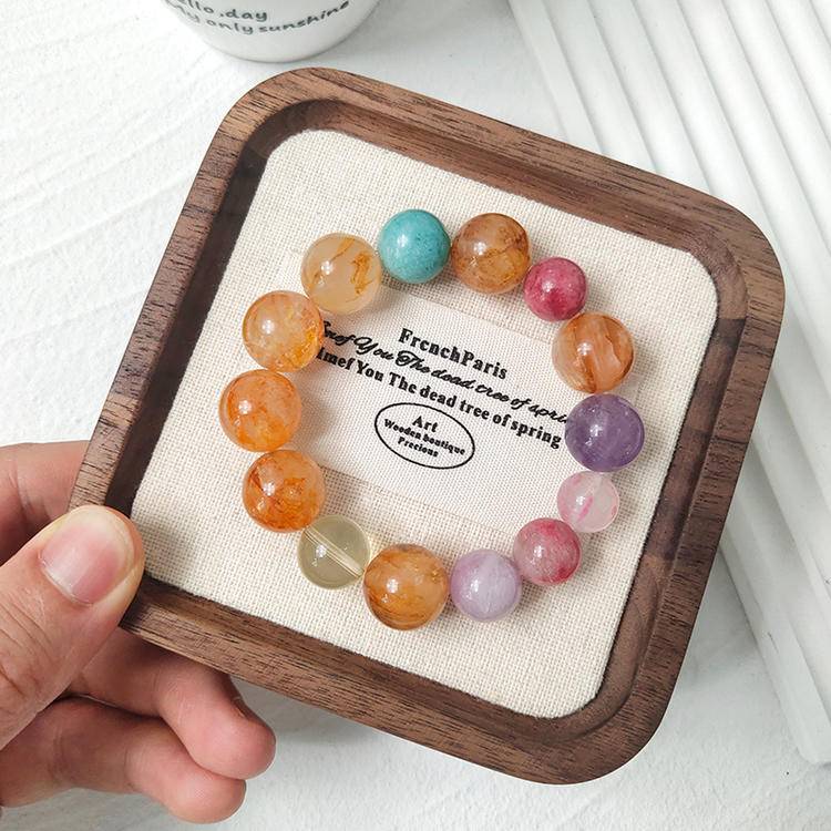 Yellow jade flower, citrine, and aquamarine multi-gemstone bracelet with lepidolite and rhodochrosite, promoting healing, balance, and positive energy.
