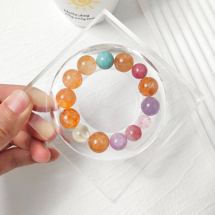 Yellow jade flower, citrine, aquamarine, lepidolite, and rhodochrosite multi-gemstone bracelet, designed to enhance healing, positive energy, and balance.
